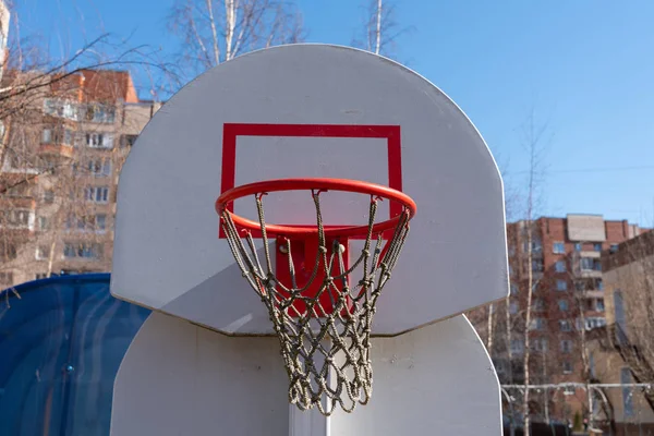 basketball Hoop with a net on a white shield on the street. close-up