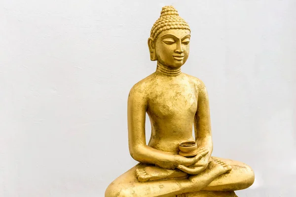 Buddha statue on the white wall background — Stock Photo, Image