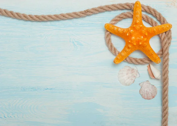 Sea background with blue wood, rope, starfish, shells — Stock Photo, Image