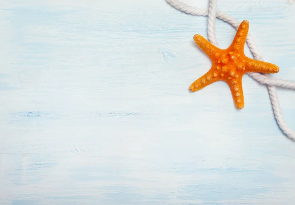 Sea background with blue wood, rope, starfish, — Stock Photo, Image