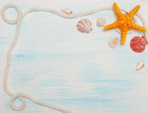 Sea background with blue wood, rope, starfish, shells — Stock Photo, Image