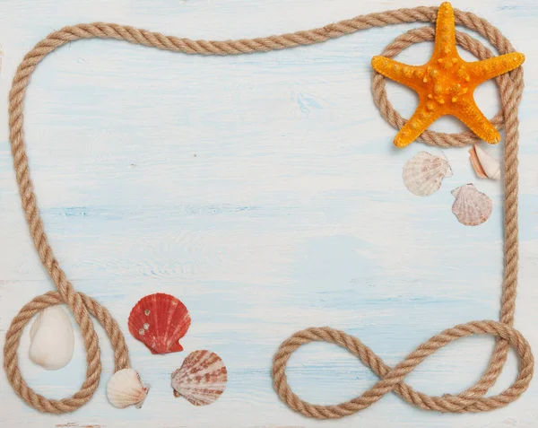 Sea background with blue wood, rope, starfish, shells — Stock Photo, Image