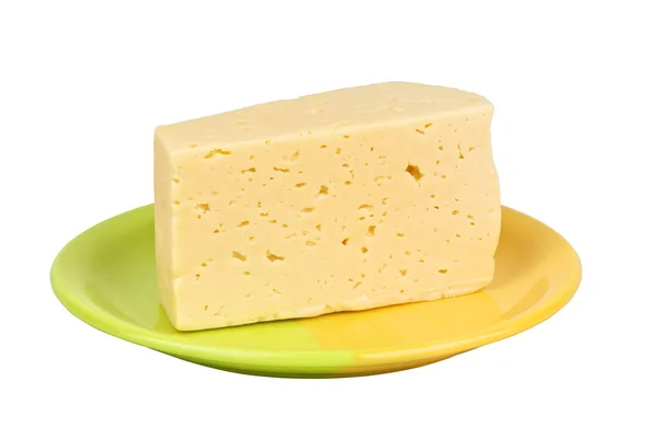 Шматочок сиру на тарілці на білому тлі — стокове фото