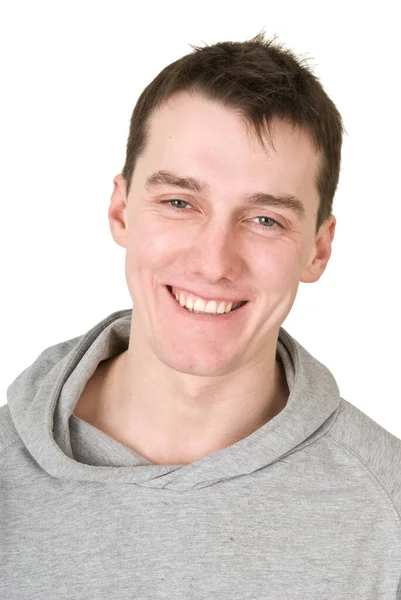 Молодий чоловік у сірому светрі на білому тлі — стокове фото