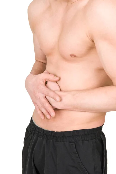 Un hombre con un torso desnudo sostiene su estómago sobre un fondo blanco —  Fotos de Stock