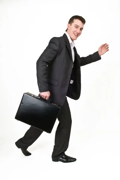 Young man in business suit with case Stock Image