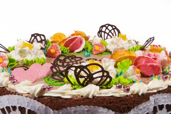 Cake with sweet cream decorations
