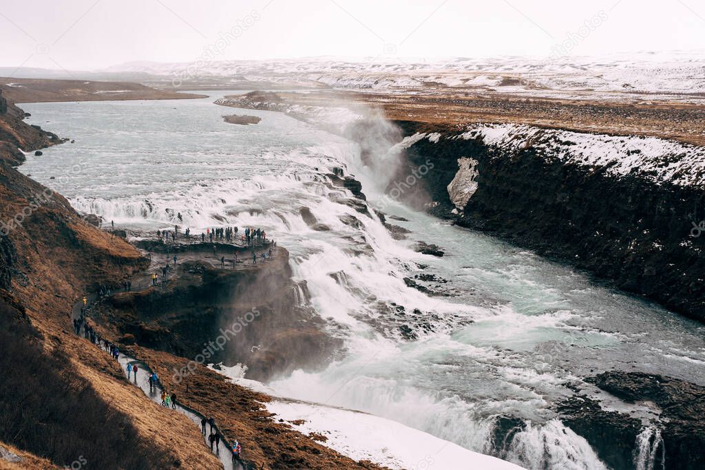 The Great Waterfall Gullfoss in southern Iceland, on the golden ring. Tourists on the observation deck.