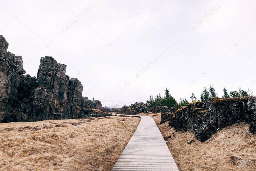 Wooden hiking trail in Sylfra Fault, Thingvedlir Valley in Iceland.