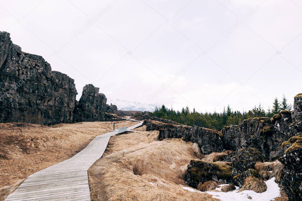 Wooden hiking trail in Sylfra Fault, Thingvedlir Valley in Iceland.