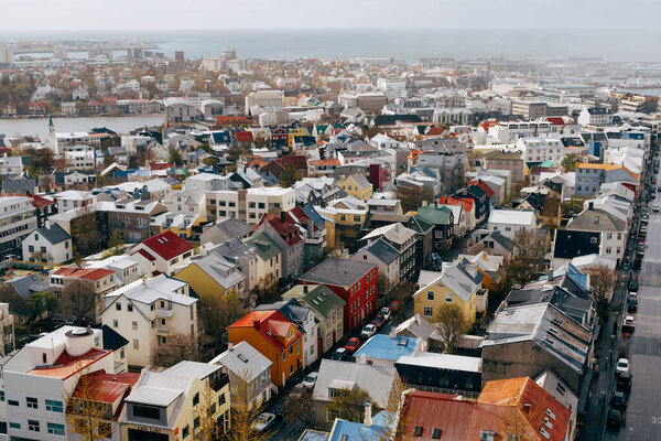Harbor Entrance Colorful Red Green Blue Houses Houses Apartment Buildings Cars Bus Streets Ocean Reykjavik Iceland. High quality photo