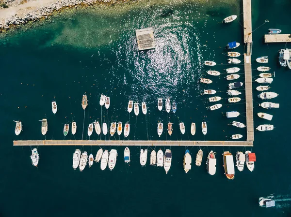 Boat dock and yacht port in Budva, Montenegro. Aerial photo from the drone, top view.