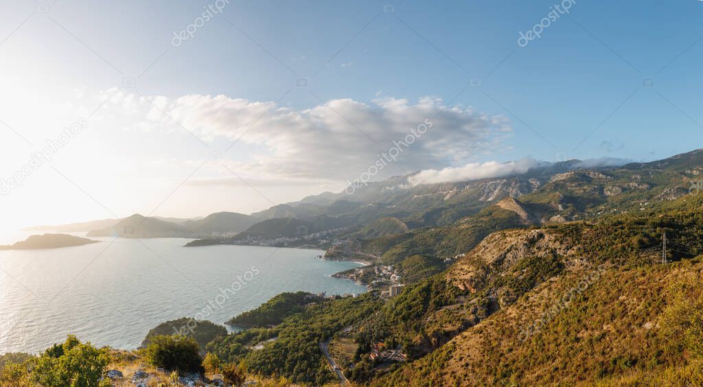 Budvan Coast. Mountains and cities along the road on the Adriatic coast in Montenegro, at sunset.