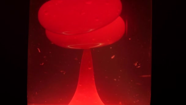 Unique patterns formed by the hot wax moving inside a red lava lamp — Stock Video