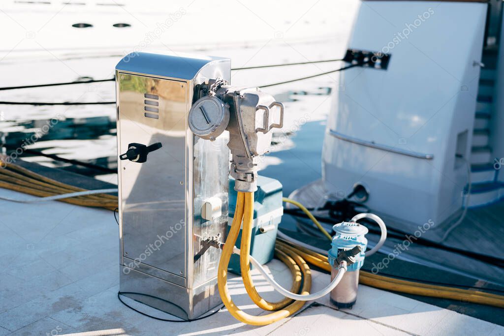 Chrome plated cabinet for marina refueling and water replenishment. Refueling and charging of yachts.