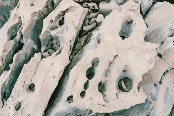 Sharp rocks with voids and holes on the Adriatic coast in Montenegro. — Stock Photo, Image