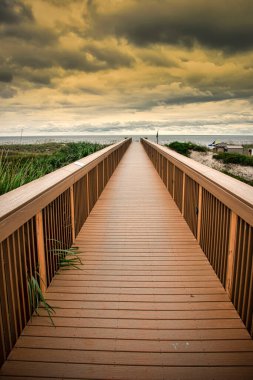 Boardwalk leading out to Fernandina Beach on Amelia Island, Florida clipart