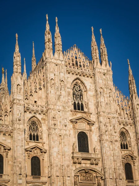 Ornate facade of Milan Catehdral in Italy at sunset — Stock Photo, Image