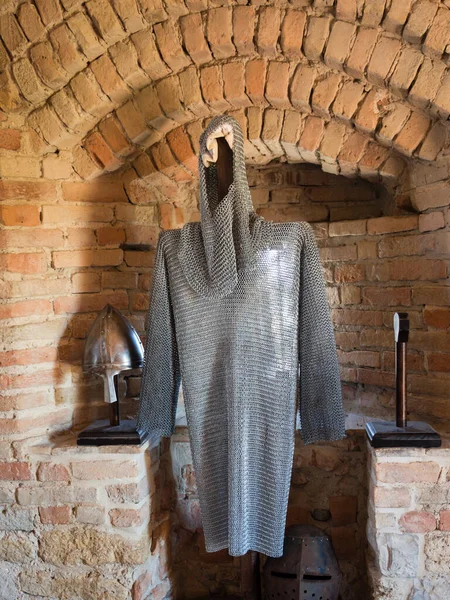 Chain mail of a medieval knight against stone wall — Stock Photo, Image