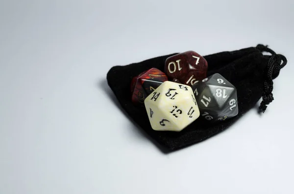 Some Rpg Dice Grouped Together Top Small Black Purse Isolated — Stock Photo, Image
