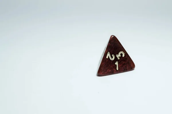 red four-sided dice, isolated on a white background. Dice of role playing game and dungeons and dragons.