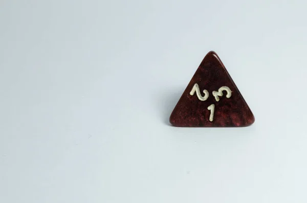 red four-sided dice, isolated on a white background. Dice of role playing game and dungeons and dragons.