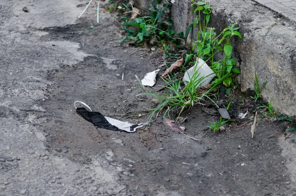 Homemade Protection Mask Thrown Street Other Garbage Accumulating Dirt Curb — Stock Photo, Image