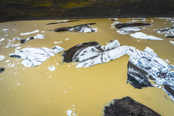 Aerial view of floating icebergs from glacier melt into the lake Stock Picture