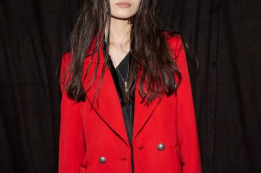 MILAN, ITALY - JANUARY 14: Beautiful model poses in the backstage just before Isabel Benenato show during Milan Men's Fashion Week on JANUARY 14, 2019 in Milan.