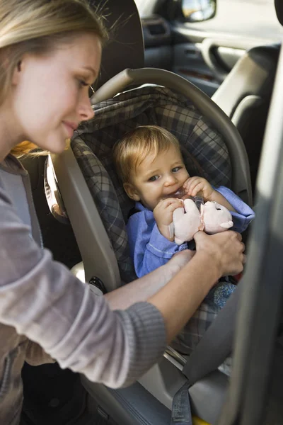 Woman Fastening Little Son Baby Seat Car — Stock Photo, Image