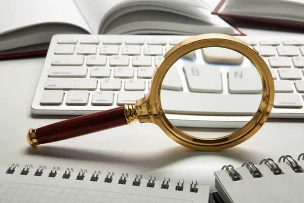 Magnifying glass on the pc keyboard search technology concept — Stock Photo, Image