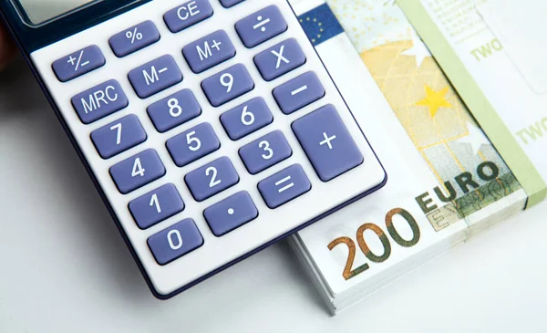 Business Still Life Calculator Bundle Banknotes 200 Euros Top View — Stock Photo, Image