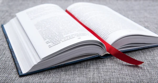 New Open Book Gray Table Red Ribbon Bookmark Close — Stock Photo, Image