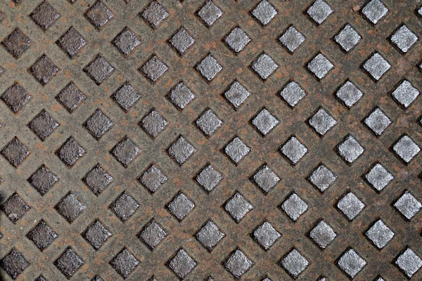 Rusty manhole pattern closeup, useful as background — Stock Photo, Image