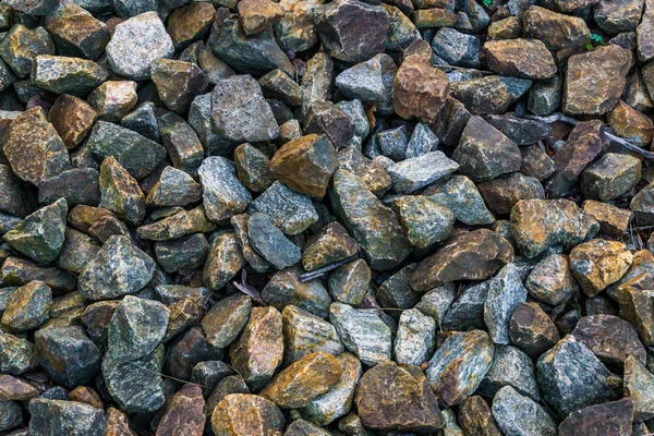 granite pebble stones ground garden decoration in many different colors and shapes macro closeup background