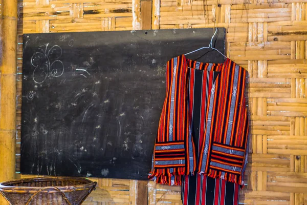 School room in african style, interior of a african class room, black board with a school or teacher uniform