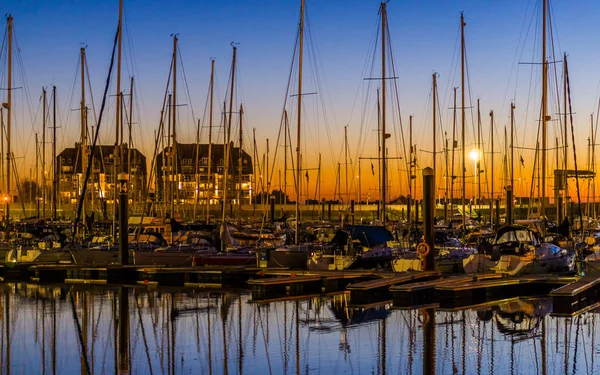 The port of Blankenberge at sunset, many docked boats, beautiful city scenery of a popular town in Belgium — Stock Photo, Image