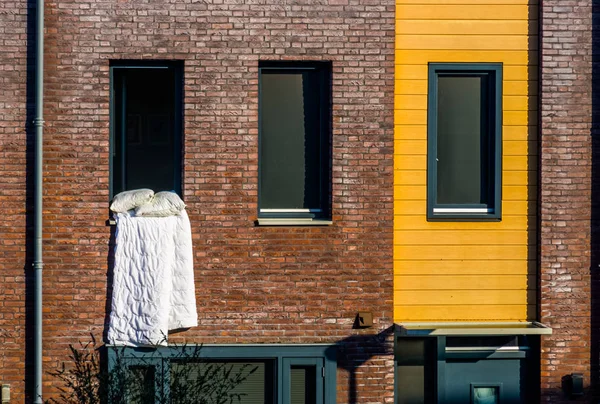 White Blanket hanging outside of the window, Ventilating the bed linen, typical dutch Architecture — Stock Photo, Image