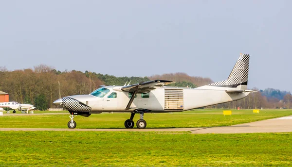 White airplane driving by in closeup, aircraft on the airport, air transportation — Stock Photo, Image