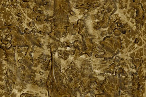 golden abstract background with paint splashes texture