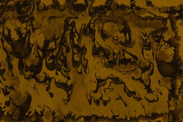full frame image of gold abstract paint background