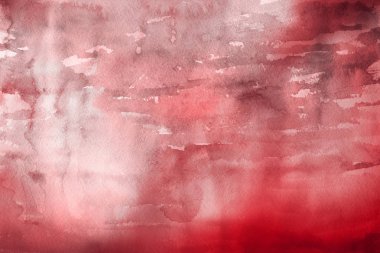 Kağıt arka plan üzerinde kırmızı sulu boya boya