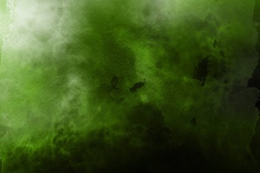 Kağıt arka plan üzerinde yeşil suluboya boya