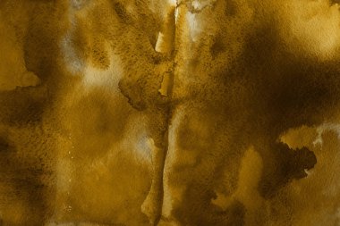 Kağıt arka plan üzerinde altın suluboya boya