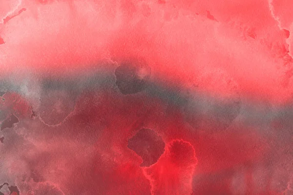 red watercolor paint on paper abstract background