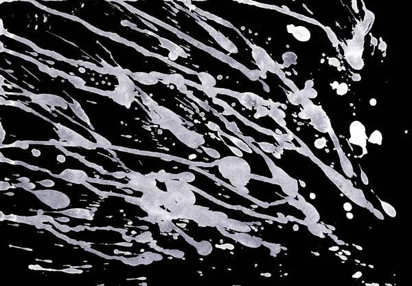 abstract white paint splatters texture on black background