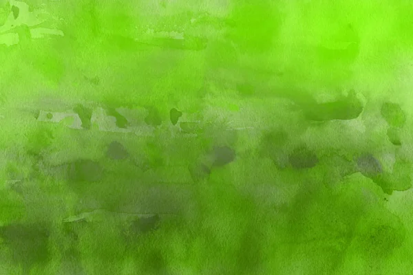 green watercolor paint on paper abstract background