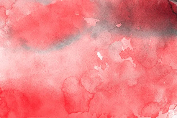 red watercolor paint on paper abstract background