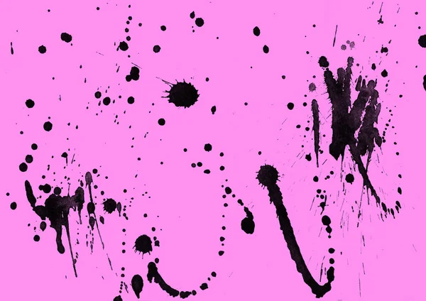 abstract black paint splatters texture on pink background