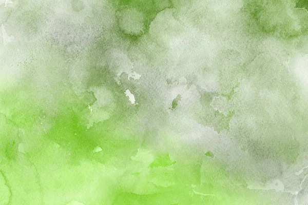 green watercolor paint on paper abstract background